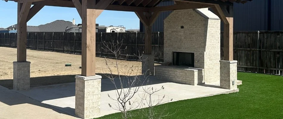 Backyard in Lubbock, TX, with an outdoor fireplace.