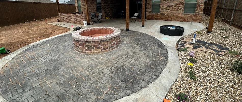 Brick fire pit on a patio in Lubbock, TX.