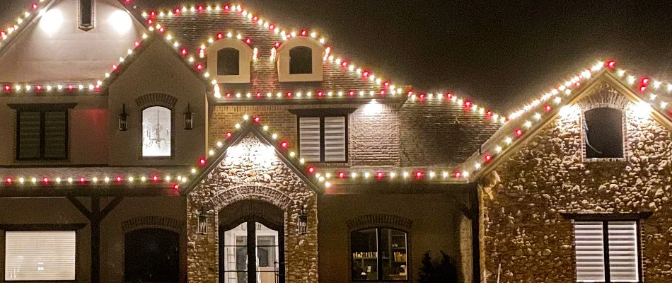 Colored Christmas lights on the eaves of a house in Lubbock, TX.
