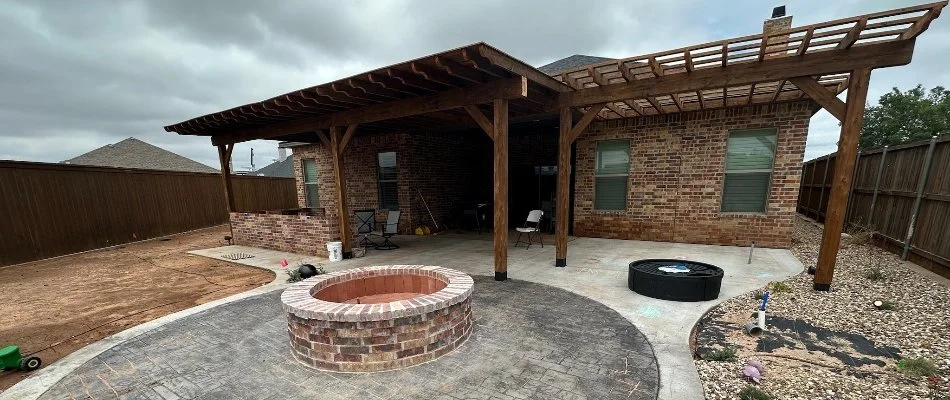 Paver patio with a fire pit and pergola in Lubbock, TX.
