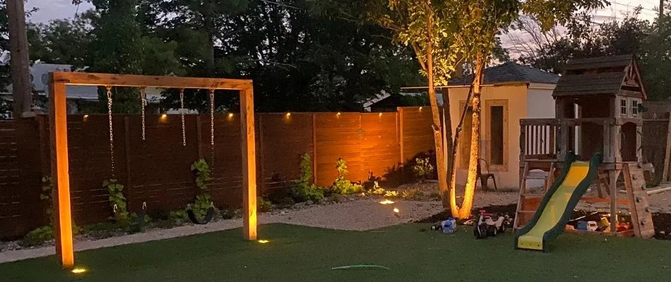 Wall-washing lighting technique on a fence in Lubbock, TX.