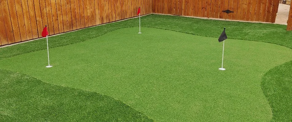 Artificial turf as putting green in a yard in Lubbock, TX.