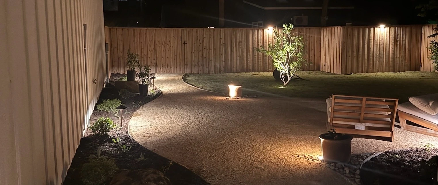 Backyard in Lubbock, TX with landscape lighting installed.