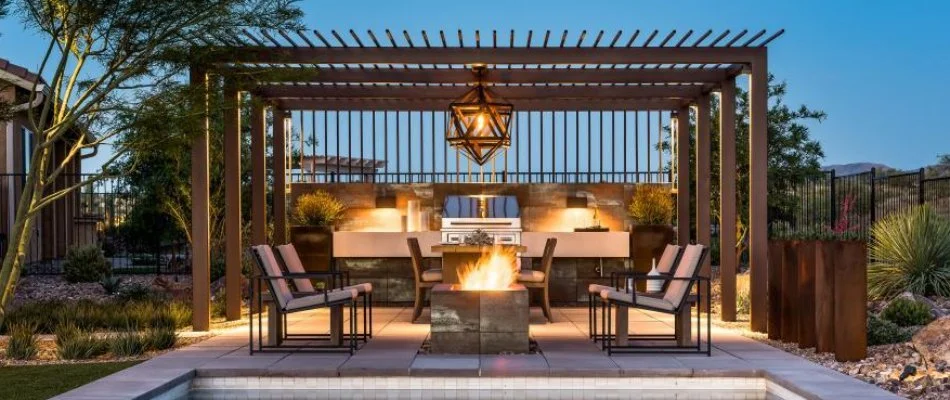 Fire pit below a pergola in Lamesa, TX.