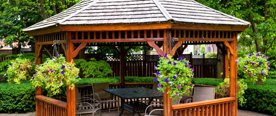 Gazebo in Lubbock, TX, with flowers in hanging pots.