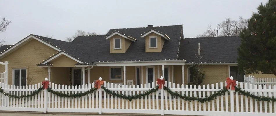 House in Lockney, TX, with holiday lighting and garlands.