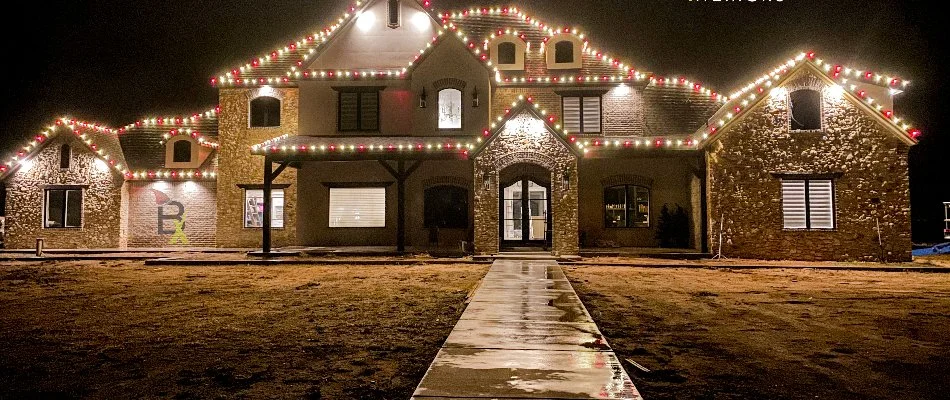 Large house in Muleshoe, TX, with colorful Christmas lights.