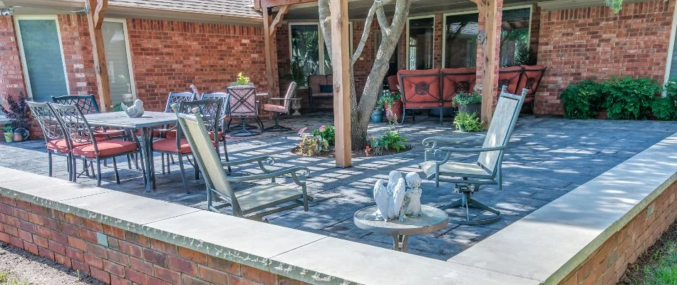Patio area with seating wall in Seth Ward, TX.