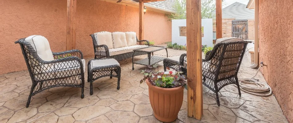 Patio area with chairs and a flower pot in Lubbock, TX.