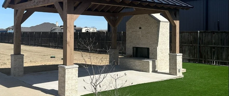 Patio in Ralls, TX, with pavilion and outdoor fireplace.
