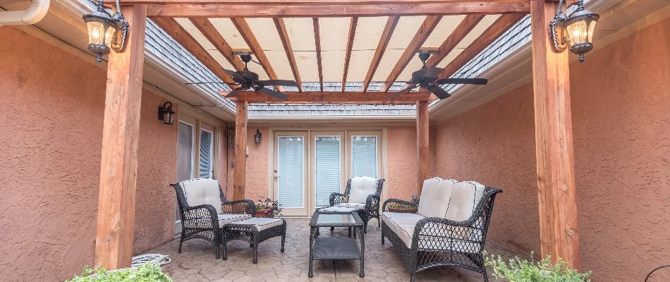 Pergola over a patio in Slaton, TX, with furniture.