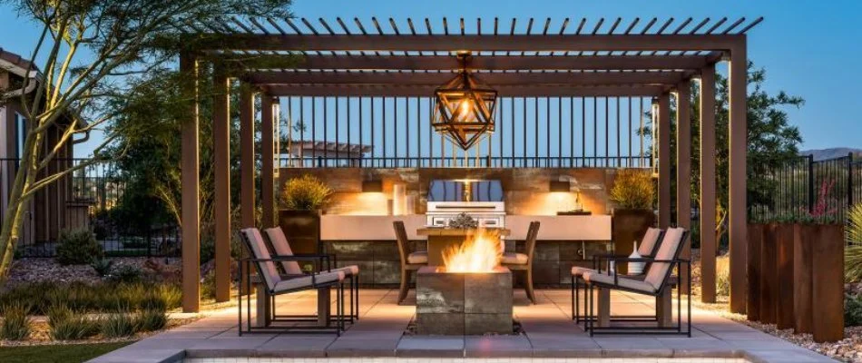 Pergola in Crosbyton, TX, with fire pit and outdoor kitchen.