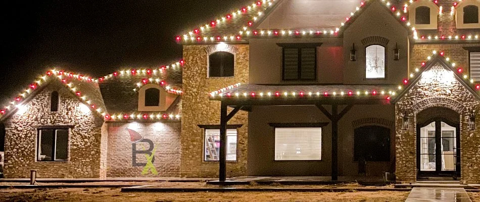 White and red holiday lights on a house in Floydada, TX.