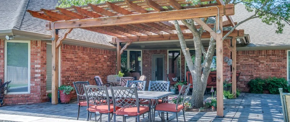 Wooden pergola over a patio in Idalou, TX.