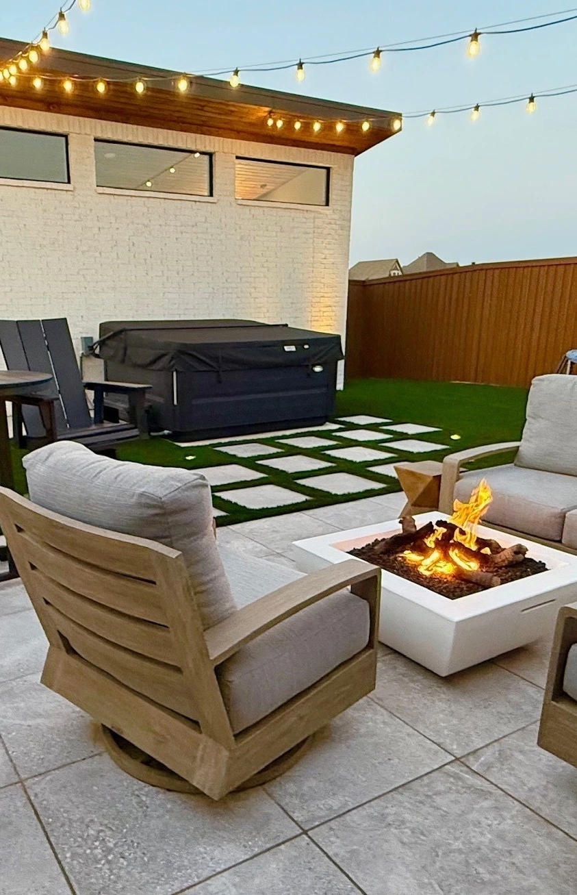 Stamped concerte patio and brick retaining wall in backyard in Shallowater, TX..